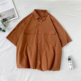 Chemise homme été manches courtes | Chemise homme couleurs bonbon | Chemise homme couple décontractée | Chemise col rabattu homme | Chemise homme poches simples | Chemise loose été homme | Chemise Harajuku homme mode | Chemise unie homme tendance | Chemise été homme fashion | Chemise ample colorée homme