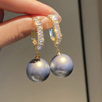Boucles perles grises femme | Boucles d’oreilles fantaisie perles | Boucles grises chic | Boucles d’oreilles légères tendance | Bijoux femme perles grises | Boucles mode élégantes | Boucles fantaisie femme | Perles fantaisie grises | Boucles d’oreilles grises femme | Boucles tendance perles