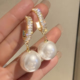 Boucles perles grises femme | Boucles d’oreilles fantaisie perles | Boucles grises chic | Boucles d’oreilles légères tendance | Bijoux femme perles grises | Boucles mode élégantes | Boucles fantaisie femme | Perles fantaisie grises | Boucles d’oreilles grises femme | Boucles tendance perles