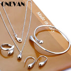 Pendentif goutte d'eau femme élégant | Bague goutte d'eau chic | Bracelet goutte d'eau mode | Boucles d'oreilles goutte d'eau tendance | Ensemble bijoux goutte d'eau femme | Bijoux goutte d'eau raffinés | Pendentif femme mode | Bague femme élégante | Bracelet femme design | Boucles femme élégantes